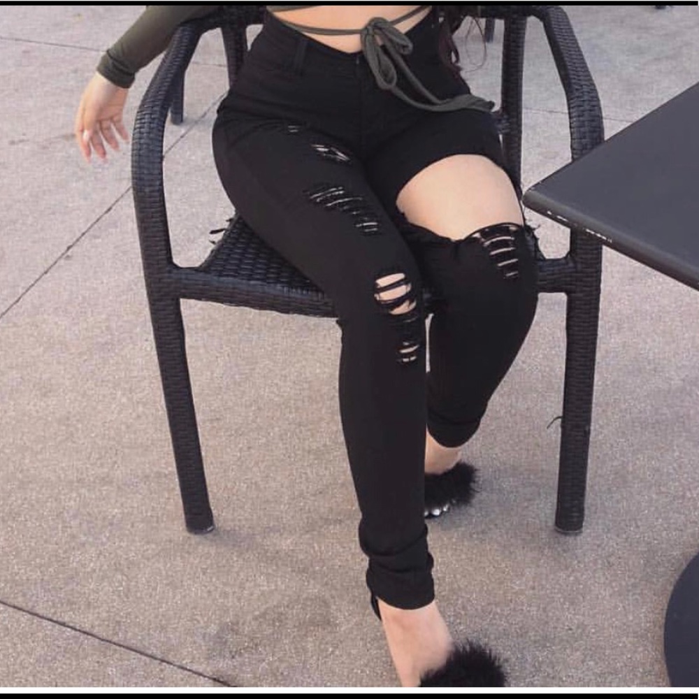 Mid rise black ripped jeans